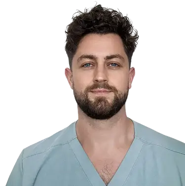 A woman with long black hair wearing a brown jacket stands confidently, showcasing her style and poise.