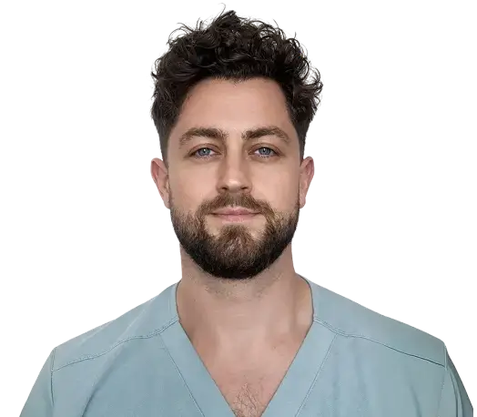 A woman with long black hair wearing a brown jacket stands confidently, showcasing her style and poise.