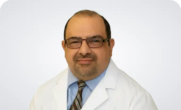 Dr. Krishna Kumar, MD, a medical professional, is depicted in a professional setting, wearing a white coat and stethoscope.