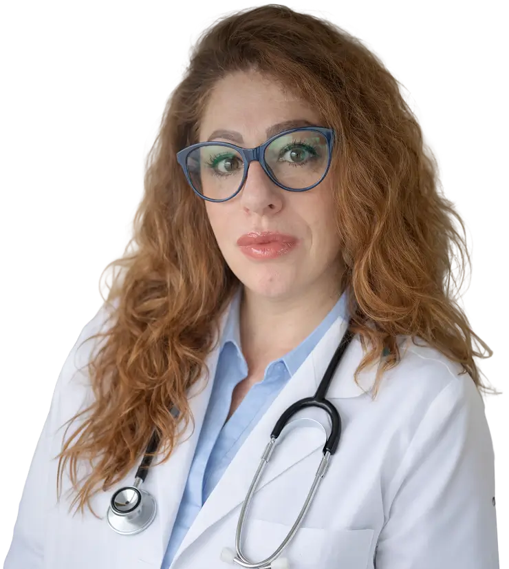 A woman wearing a white coat and glasses stands confidently, showcasing a professional appearance.