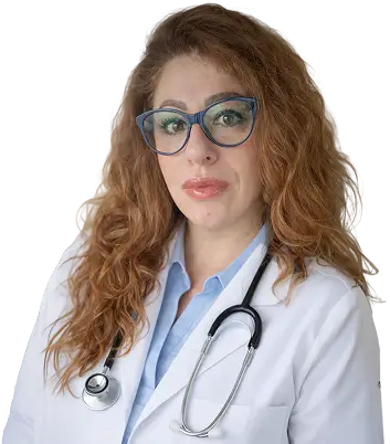 A woman wearing a white coat and glasses stands confidently, showcasing a professional appearance.